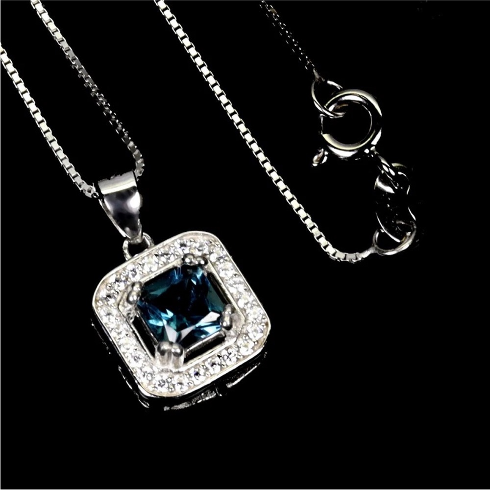 Natural London Blue Topaz .85ct w/ halo in 925 Sterling Silver setting 18”